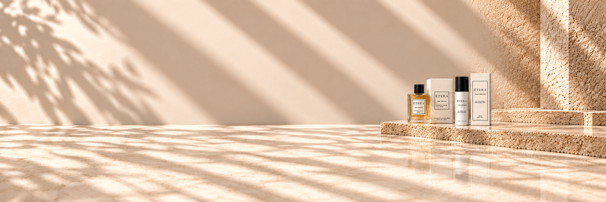 ÉTERA First Edition fragrance collection in a warm travertine setting
